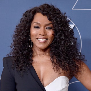 Angela Bassett with a long haircut and curls