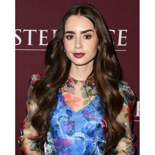 Lily Collins with a long haircut and allaround voluminous layers