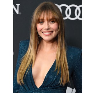 Elizabeth Olsen with a long haircut and a French fringe